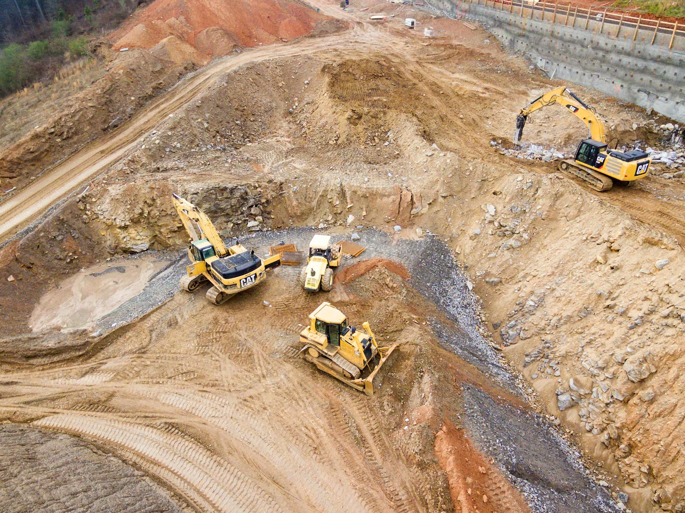 Aerial view of excavators and dozers during bulk earthworks