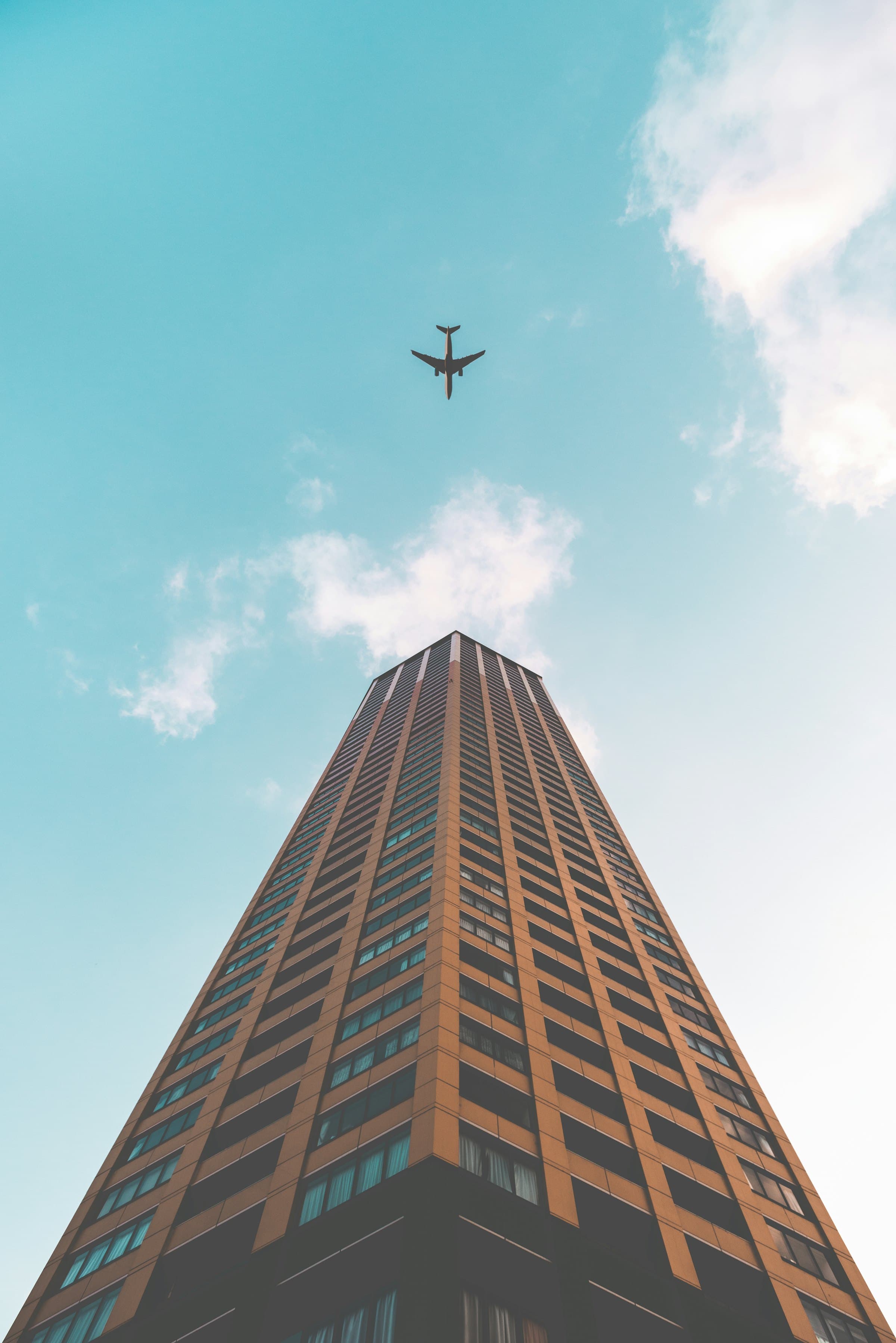 Tower seen from street level, rising into a clear sky