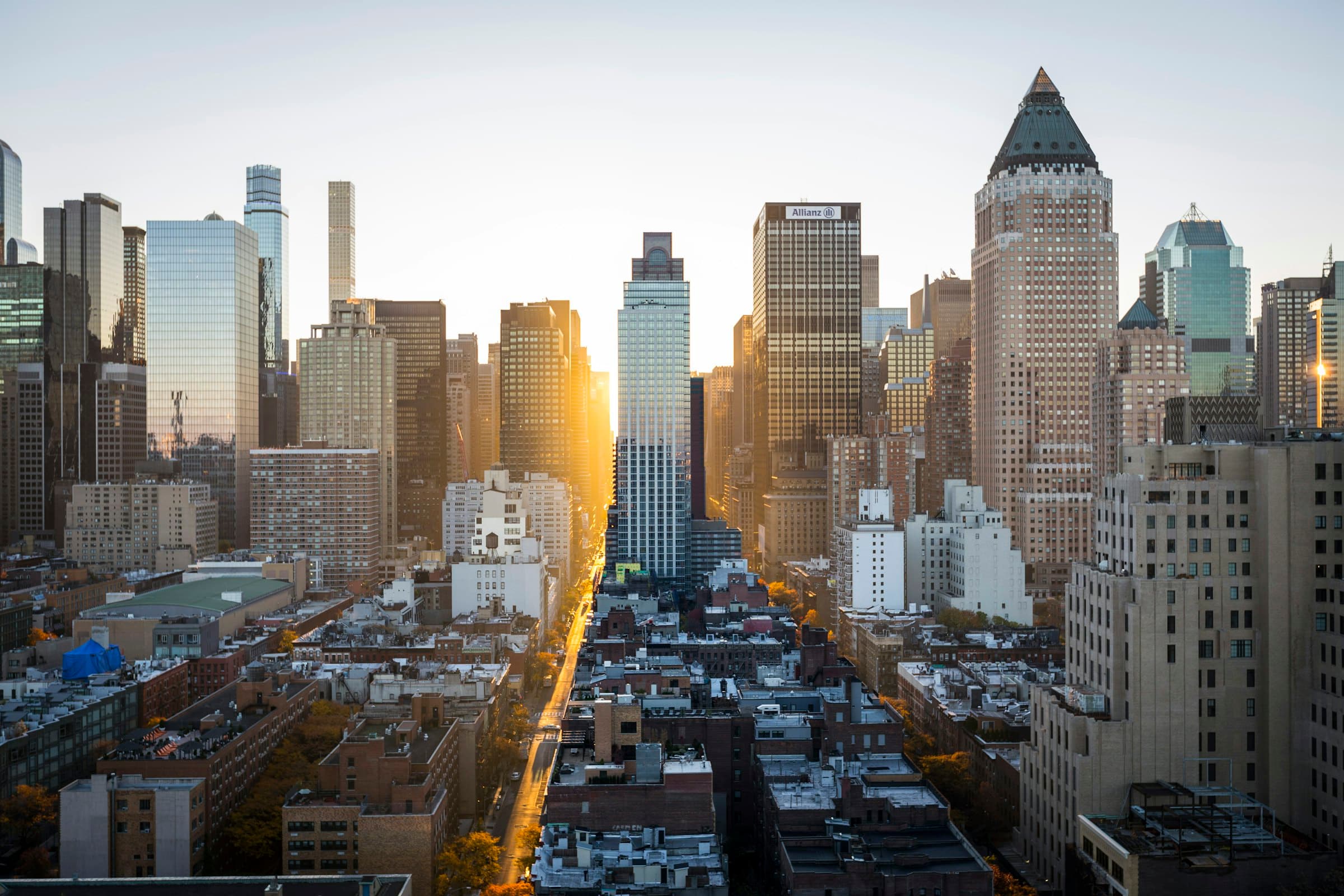 Dense city blocks at sunrise, seen from height